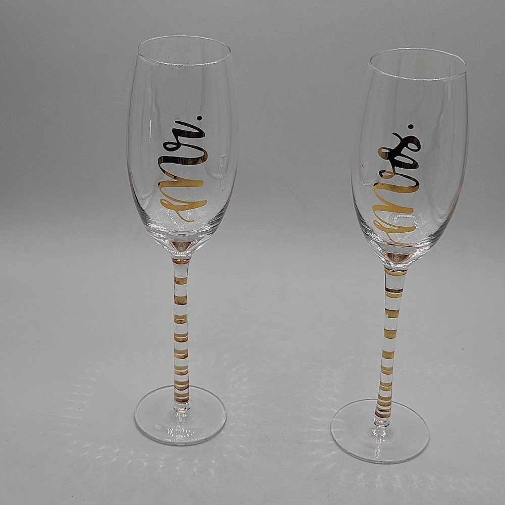 Mr and Mrs toasting glasses in package